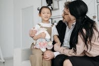 Girl Sitting on Parents Lap