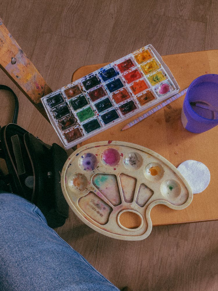 Watercolors On A Wooden Surface