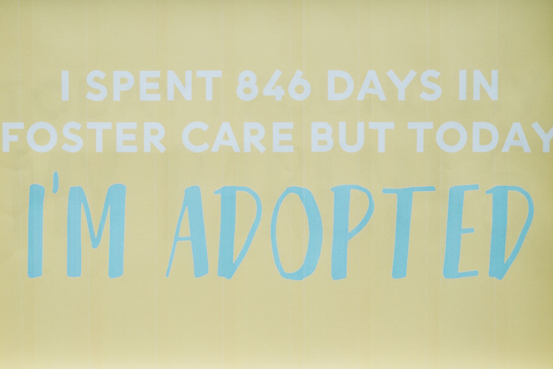 Close-up of a Sign with Text about Adoption