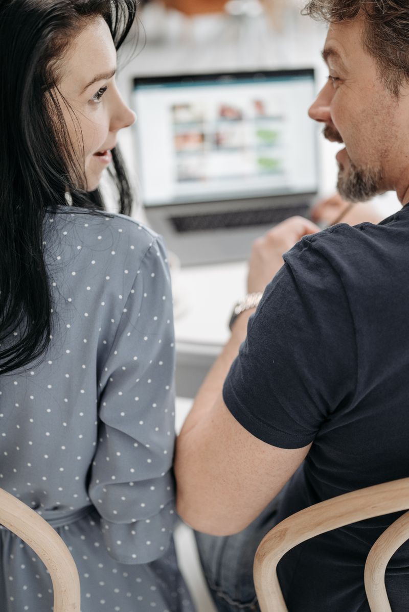 Couple engaged in a friendly face-to-face conversation; illustrative stock photograph