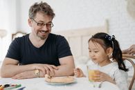 A Man Looking at His Daughter