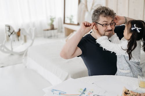 Free A Man Playing with His Daughter Stock Photo