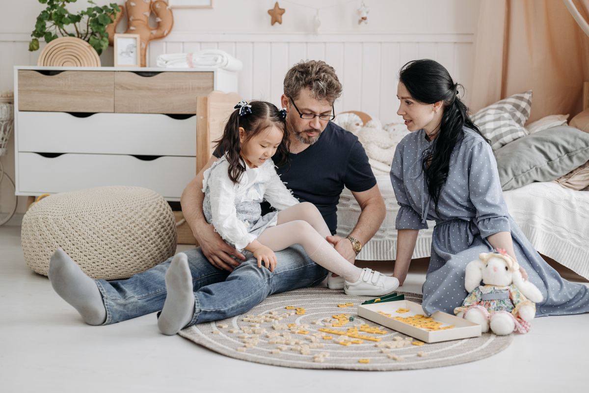 A family enjoying an educational word activity together at home