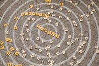 Scrabble Tiles Scattered on the Brown Carpet