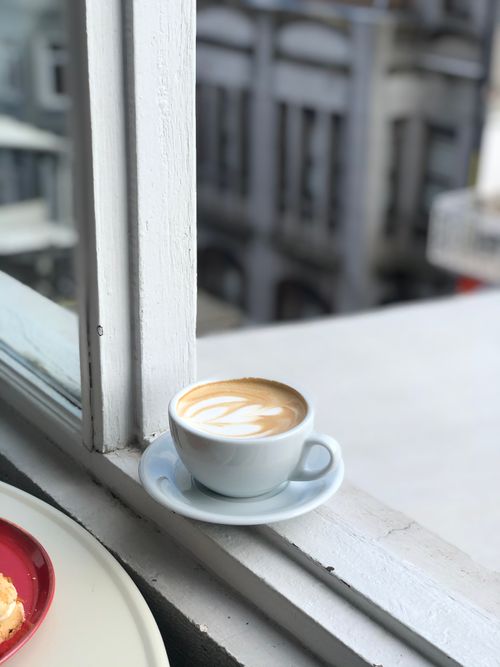 Free A cup of cappuccino on a windowsill in a cafe in Fatih, İstanbul. Perfect for a coffee break. Stock Photo