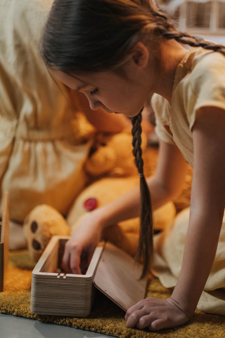 Little Girl Playing With Toys In Her Room 