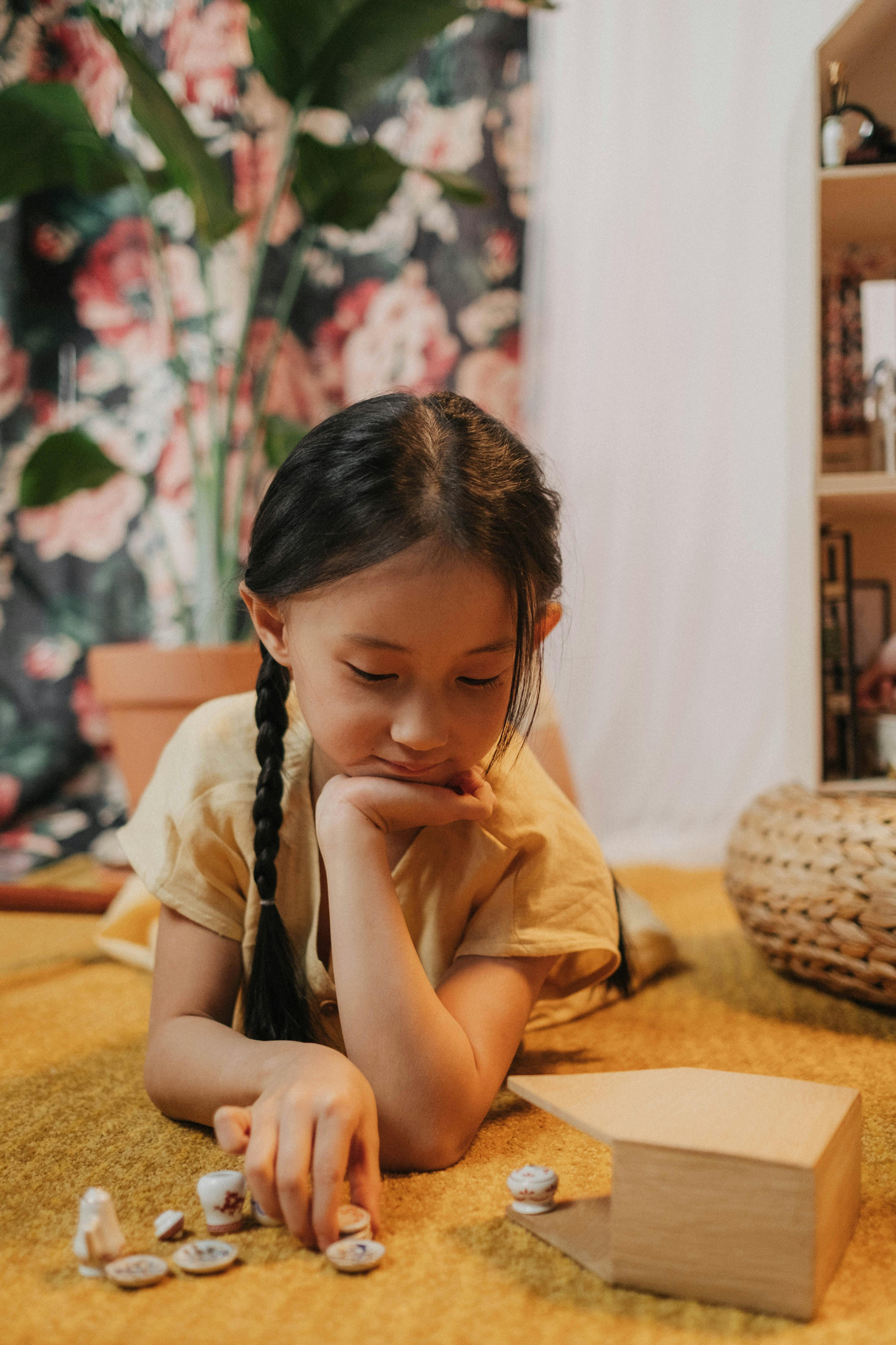 a girl playing on the floor