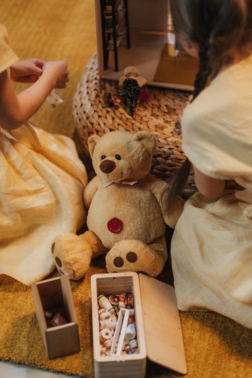 Free Brown Teddy Bear Plush Toy on the Floor Stock Photo