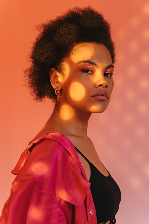 Woman with Afro Hairstyle wearing Black Tank Top