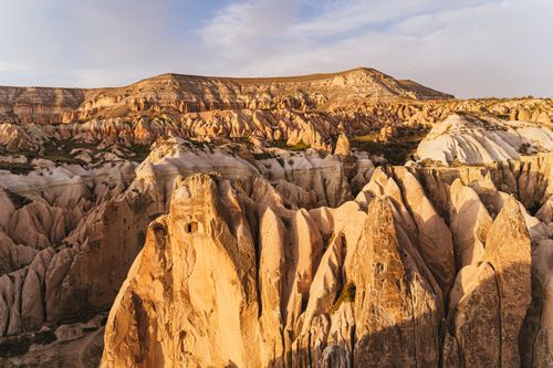 Free Explore the stunning geological rock formations of Cappadocia under a serene sky, Turkey. Stock Photo