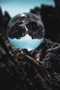 Clear Glass Ball on Black and Gray Textile