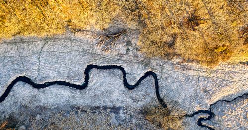 Free Aerial shot of a winding river through a frosty winter landscape in Minnesota. Stock Photo