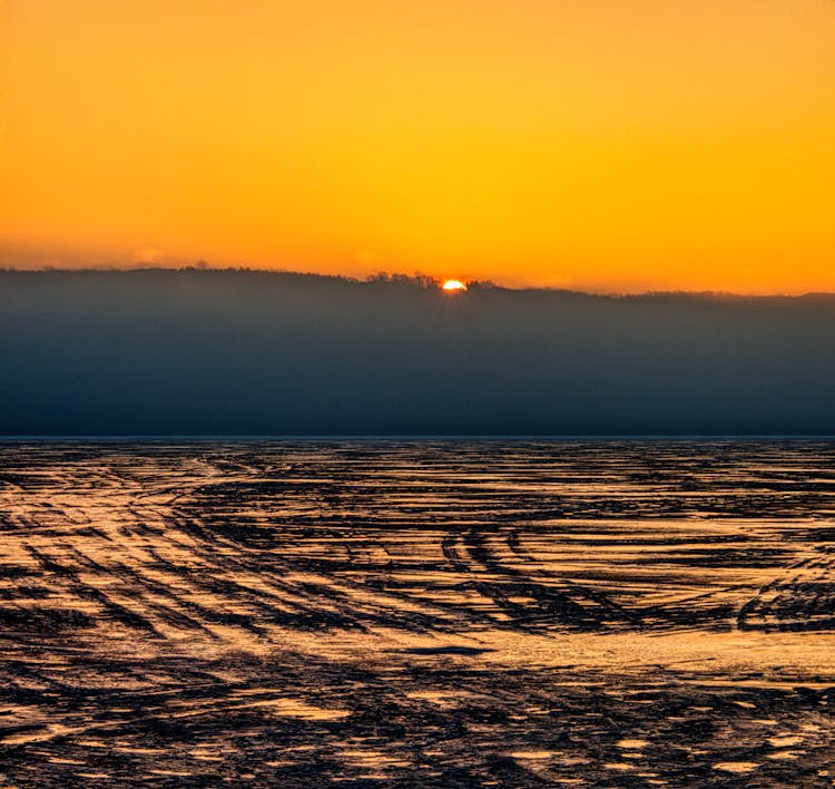 Muddy Field During Sunset