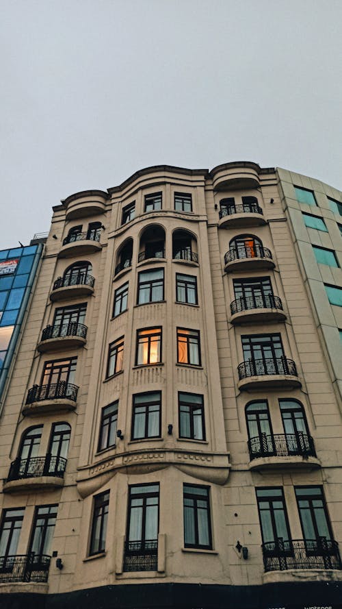 A Low Angle Shot of a Building with Glass Windows