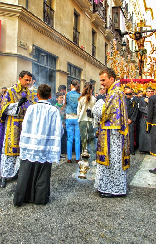 Free Colorful Catholic procession with incense burners and clergy in traditional clothing. Stock Photo