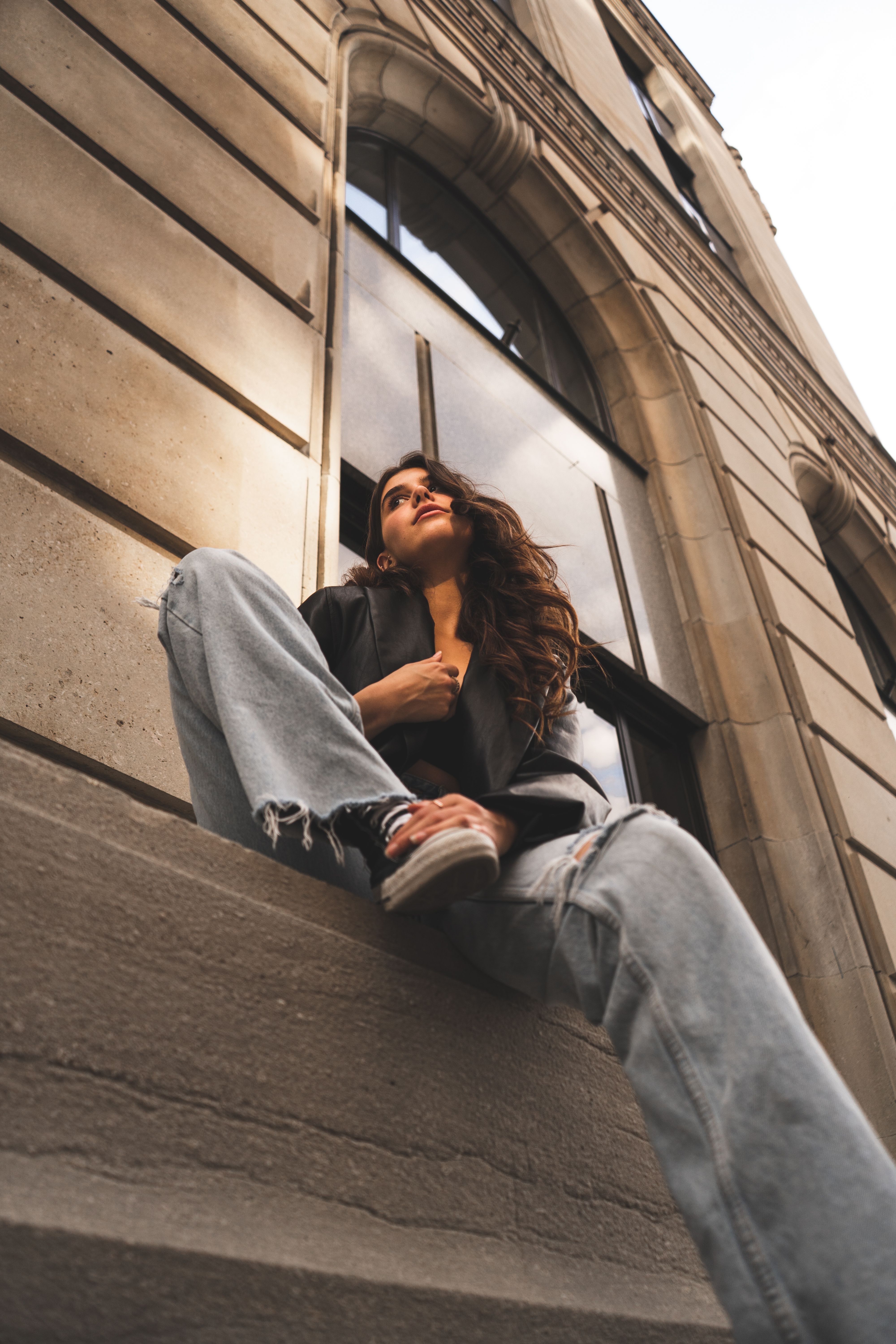 A Woman Sitting on the Concrete Bench · Free Stock Photo