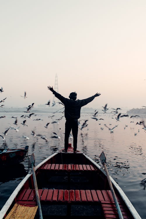 A Man Standing on the Boat