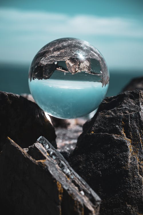 Clear Glass Ball on Gray Rock Formation