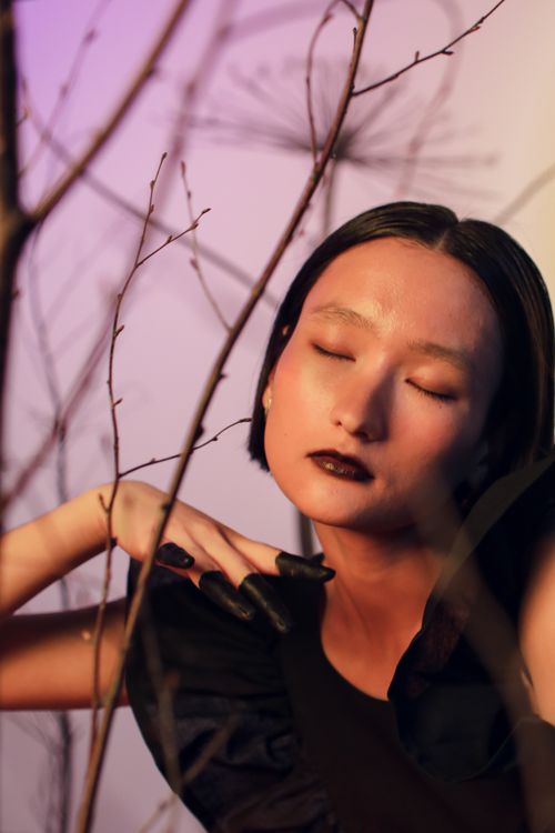 Free Intimate portrait of woman with closed eyes and dramatic lighting. Stock Photo