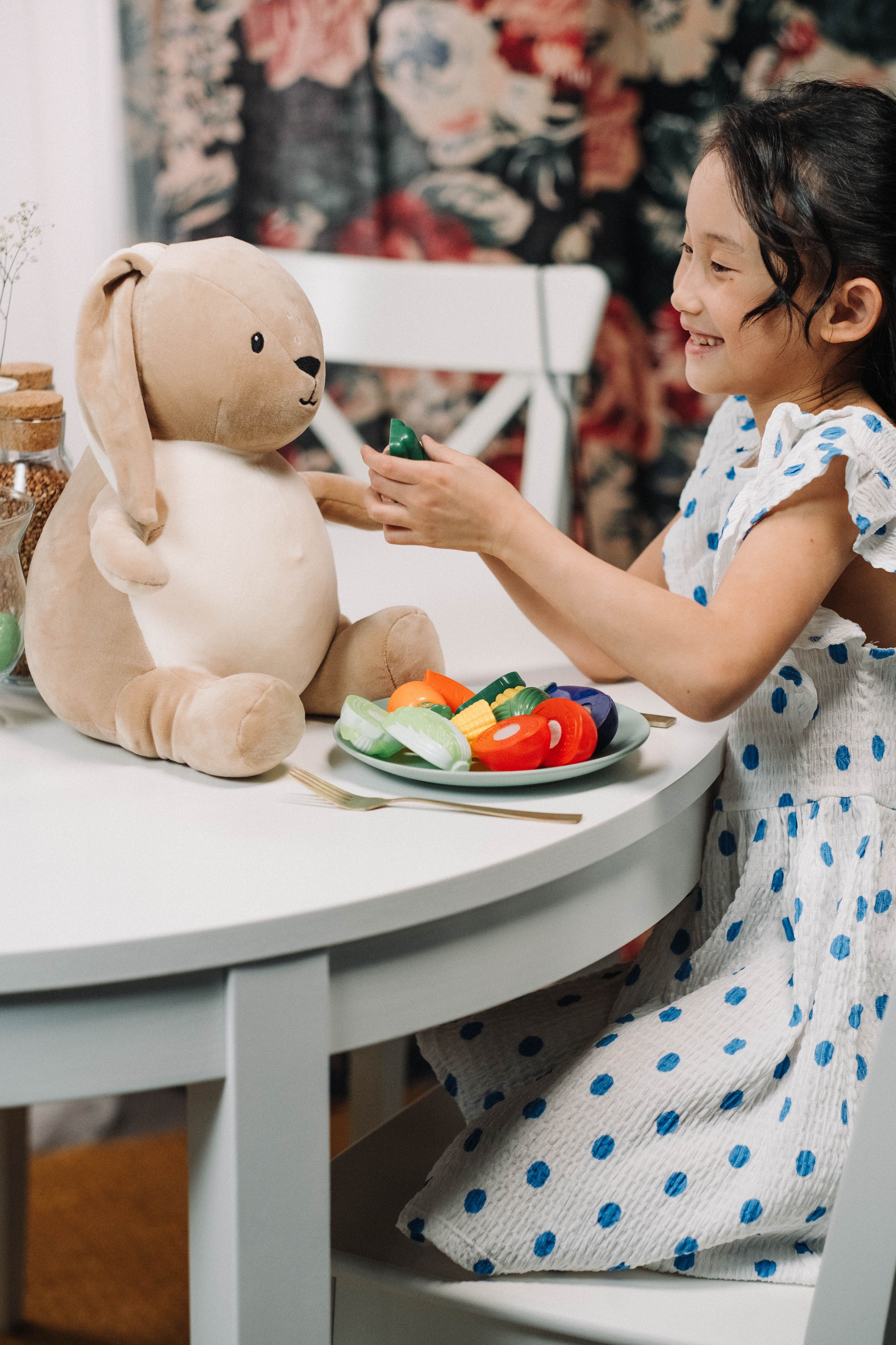 A Girl Playing with Stuffed Animal · Free Stock Photo