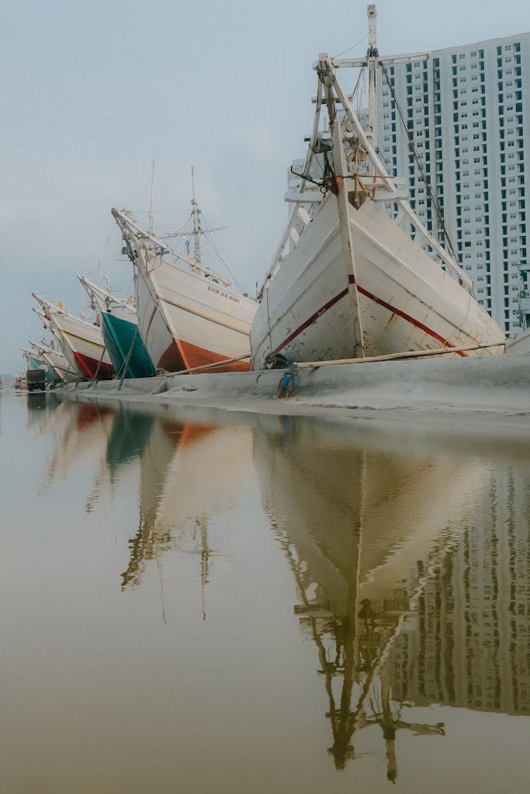 Docked Boats Reflecting In The Water