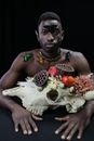 Man in White Skull Mask Holding White Skull