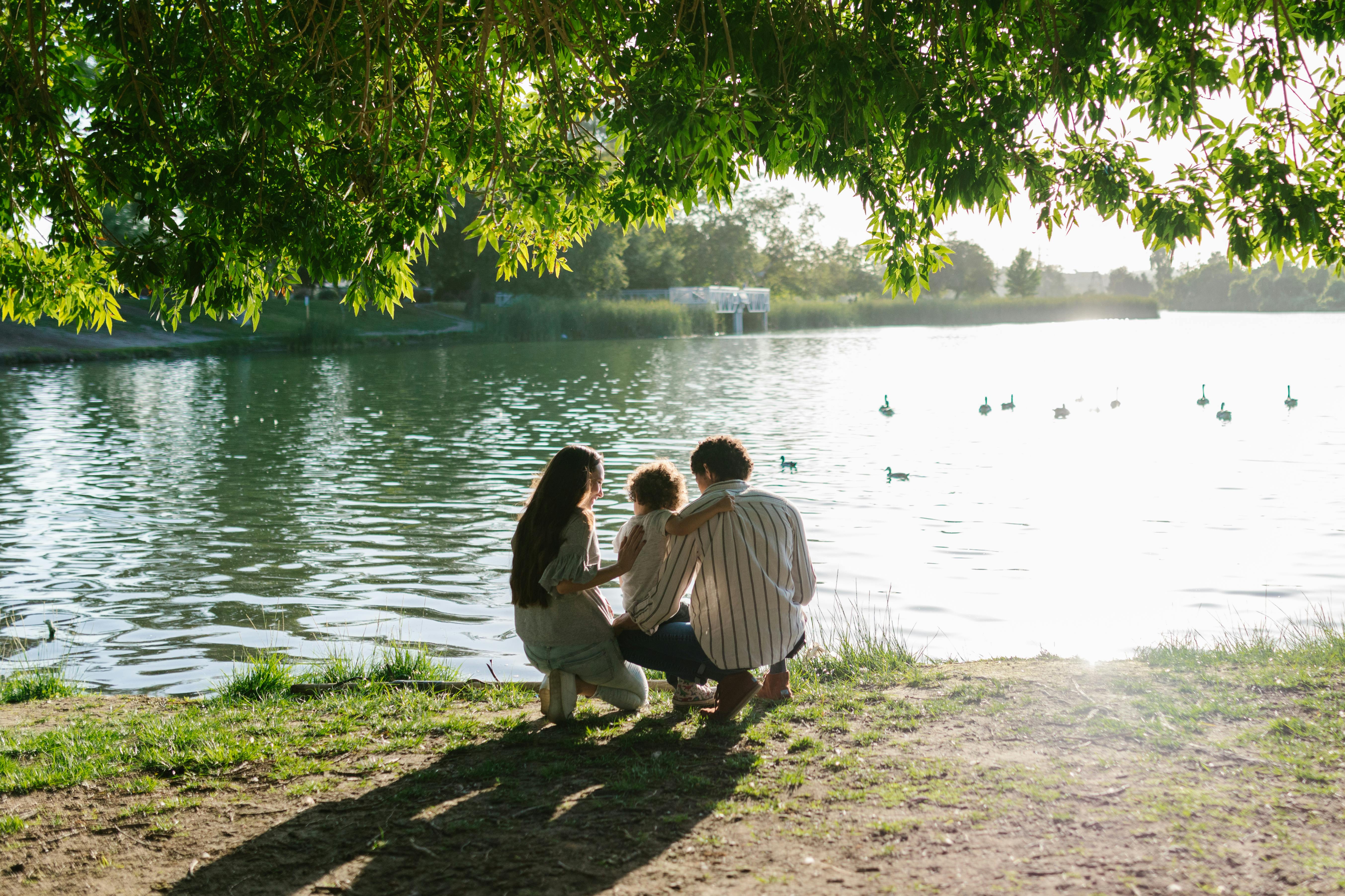 photograph of a family near a lake