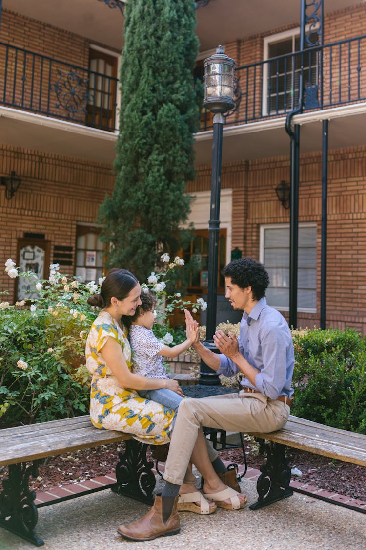 A Family Playing In The Garden