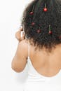 Woman in White Top with Cherries on Her Hair