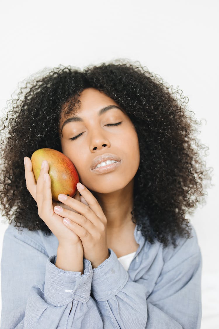 Woman Holding Fresh Mango 