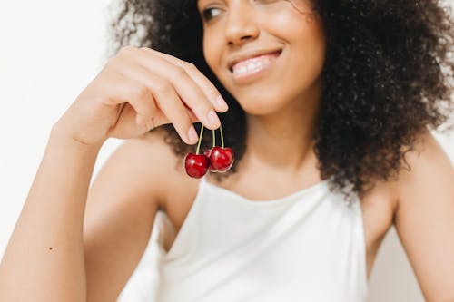A Woman Holding Cherries 