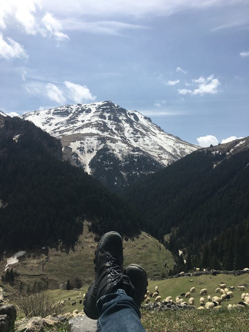 Person Legs on Mountains Landscape