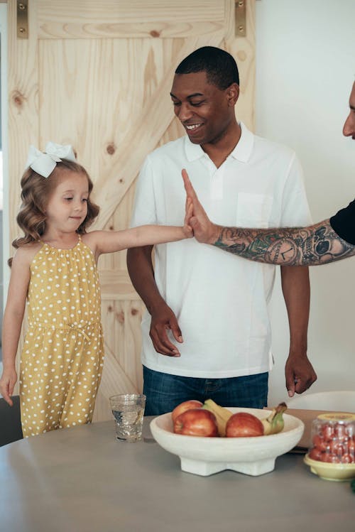 Man High Five with Girl in Kitchen