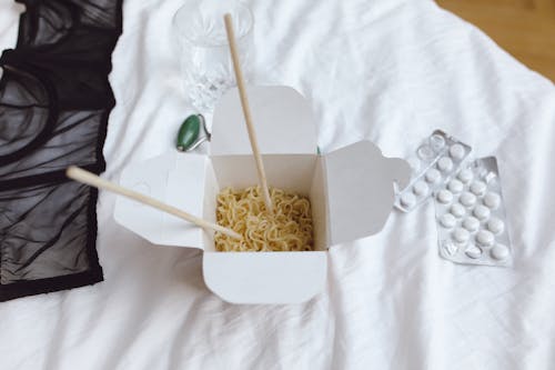 Chopsticks in a Box of Noodles