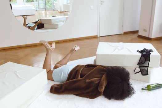 Person in White Socks Lying on Brown Textile