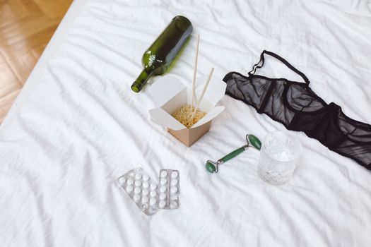 Green Glass Bottle Beside White and Brown Ice Cream Cone and White Ceramic Cup