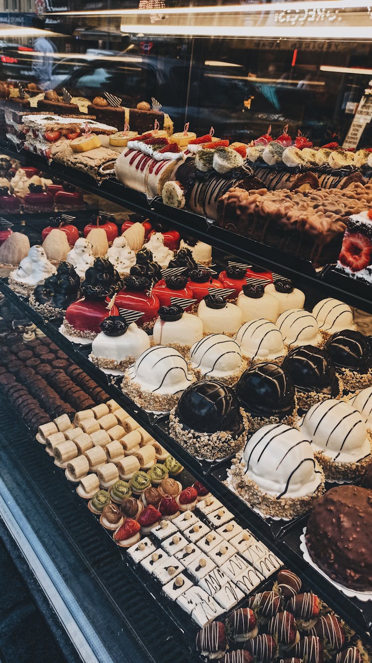 Display Of Gourmet Cakes And Sweets In A Bakery 