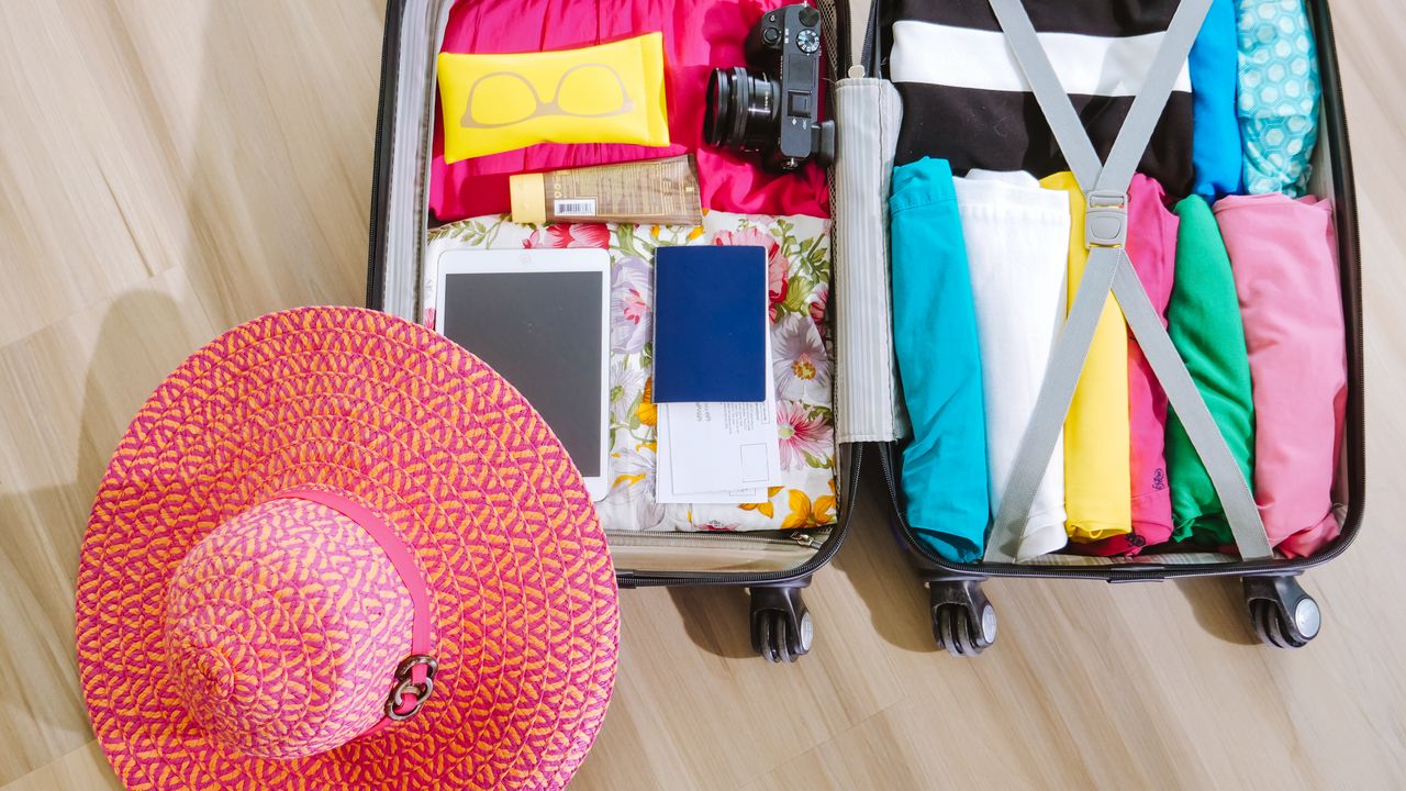 Travel light with an organized suitcase Neatly packed suitcase with travel essentials for a light packing strategy