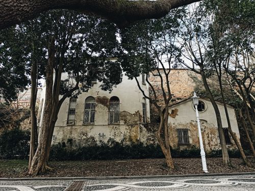 Free A weathered structure surrounded by trees in the Beşiktaş district, a glimpse of history in modern Istanbul. Stock Photo