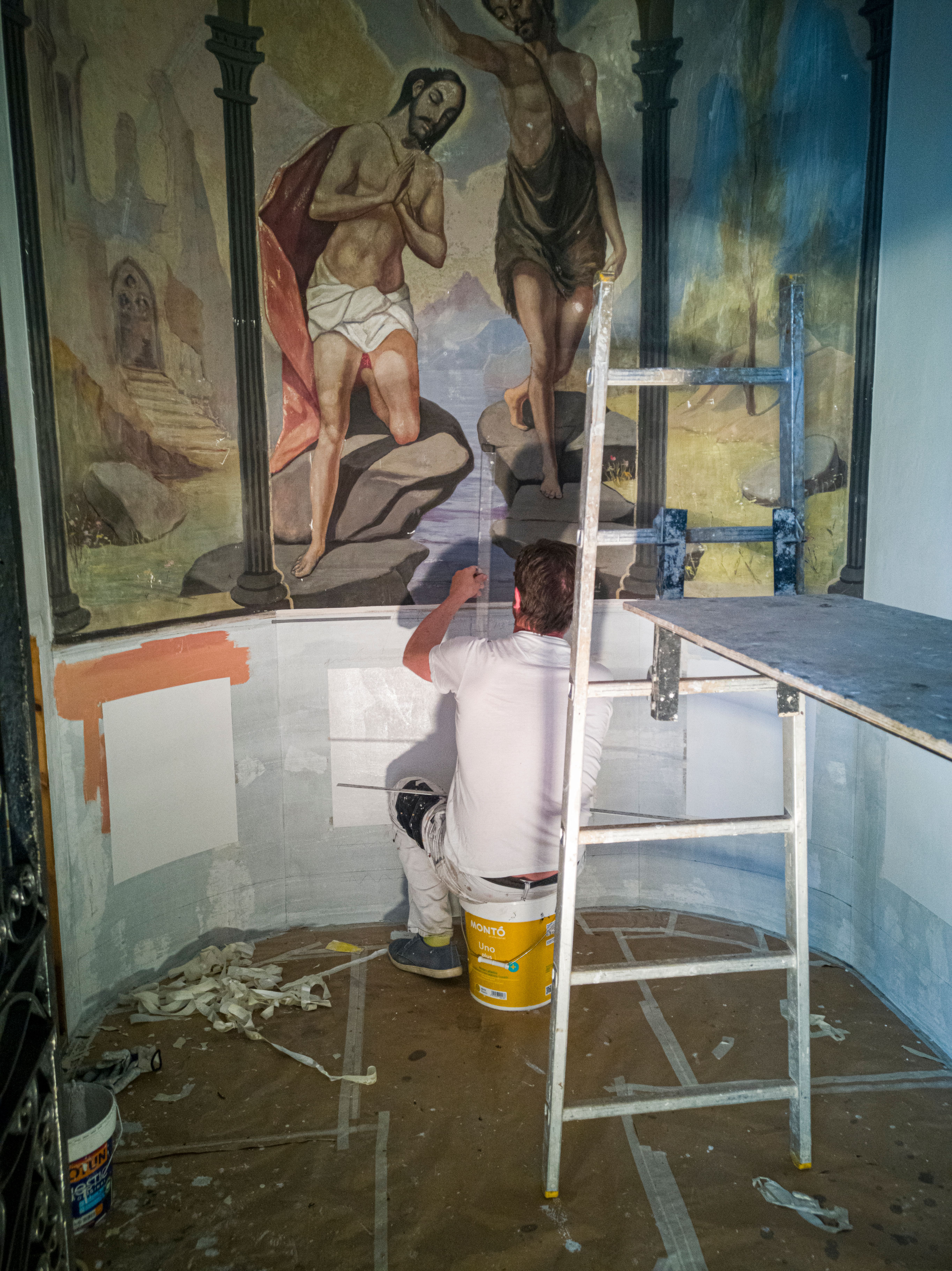 Man Restoring a Religious Painting in a Church · Free Stock Photo