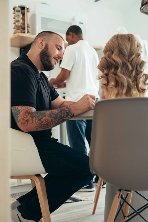 Men Sitting with Girl and Cooking