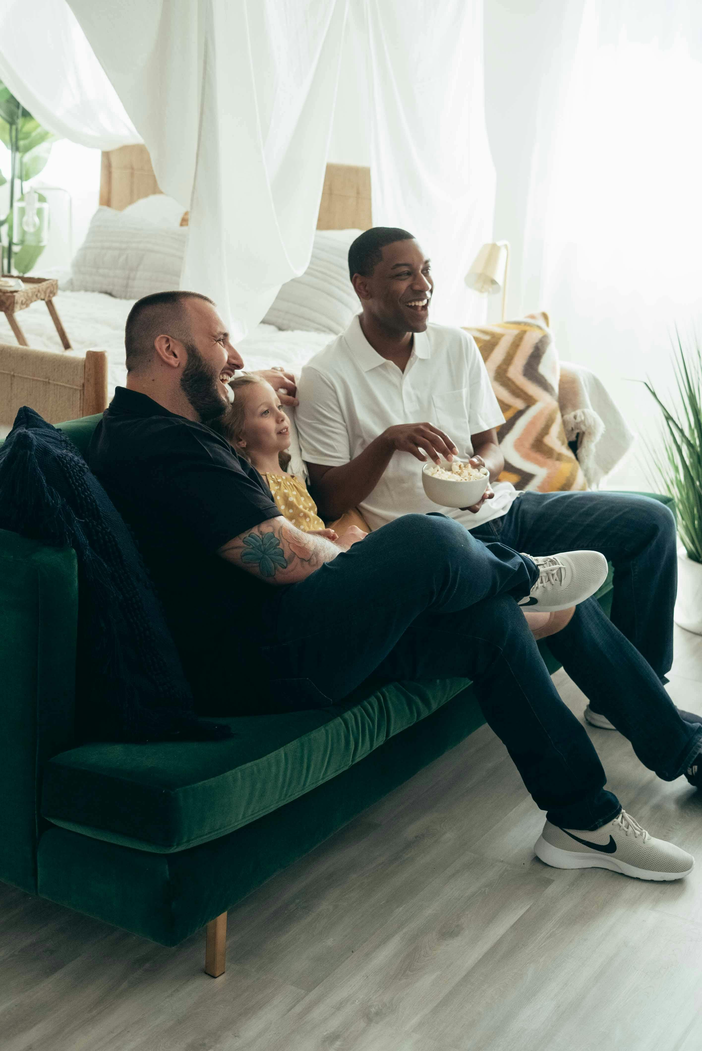 a happy family sitting together on a couch