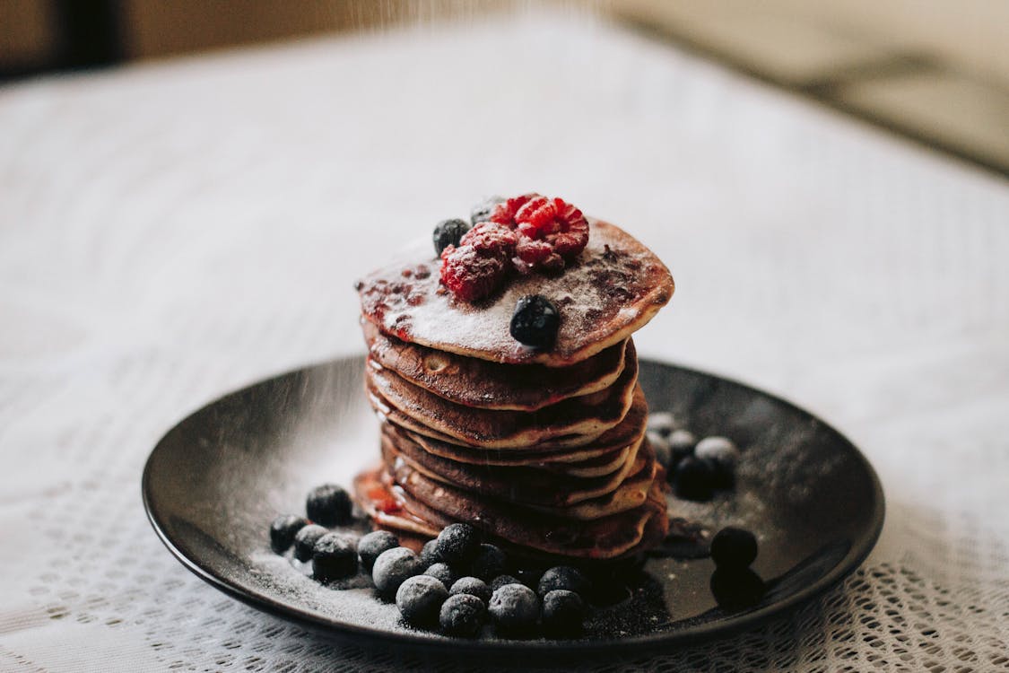 Free Pancakes With Blueberries on Black Plae Stock Photo