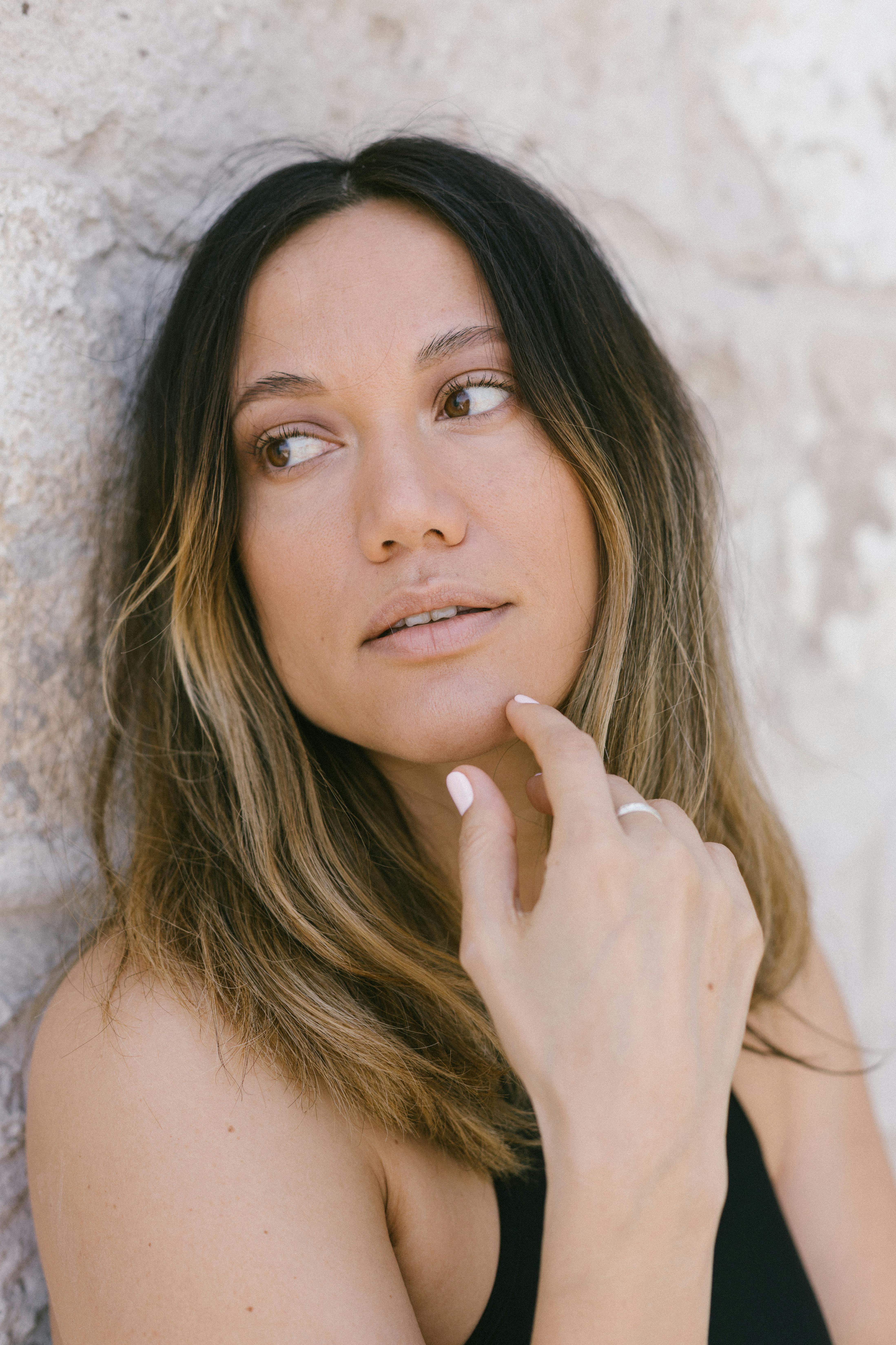 woman beside wall