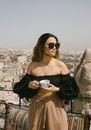 A Woman in Black Sunglasses and Black Off Shoulder Crop Top