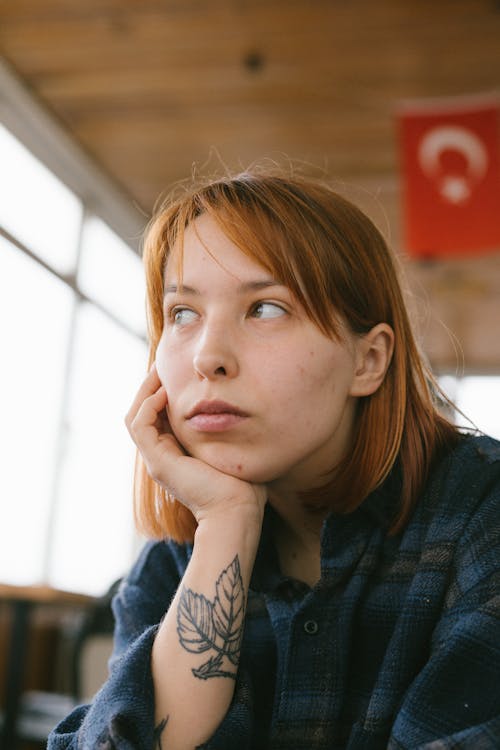 A Woman in a Plaid Shirt 