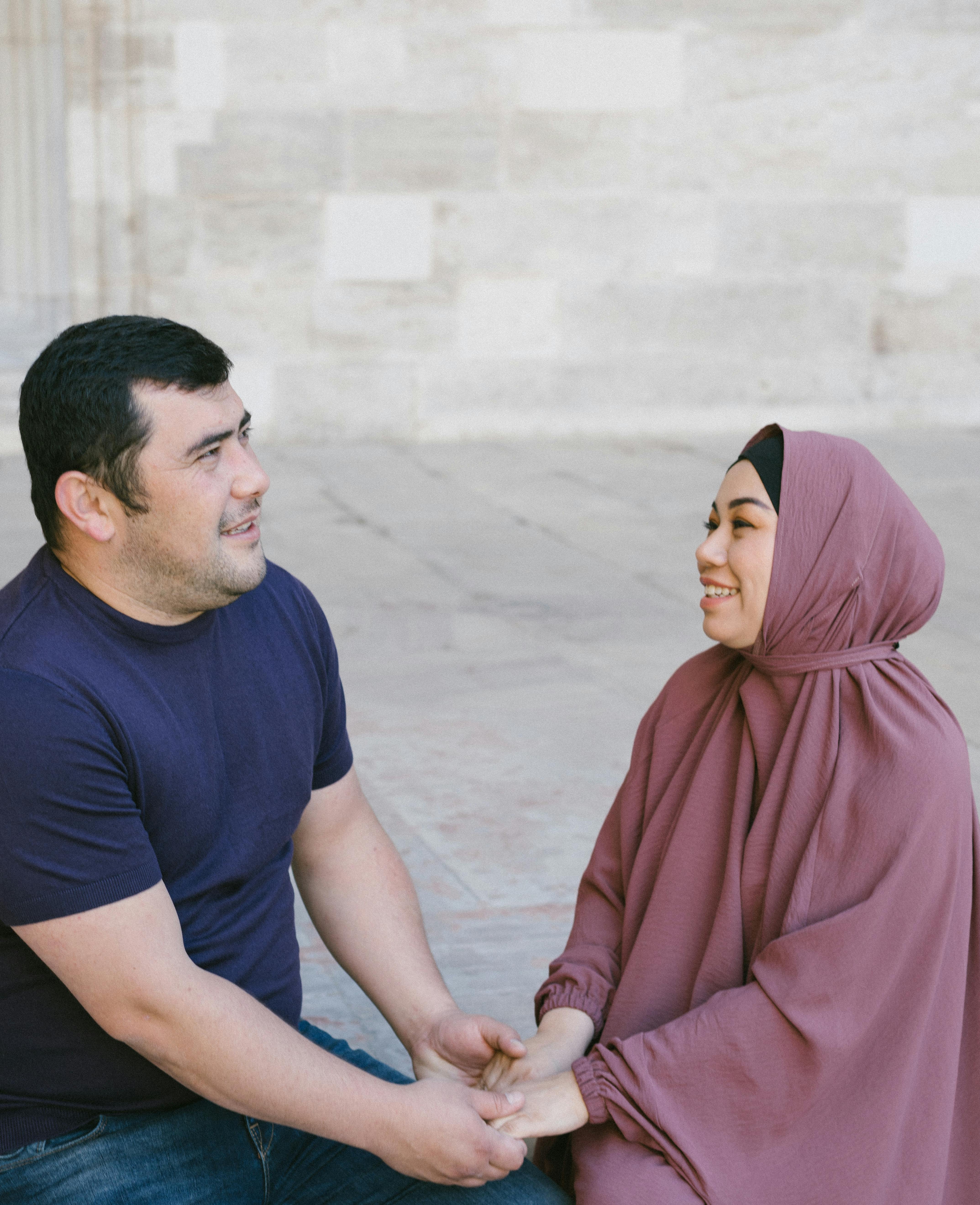 A loving couple sharing a moment outdoors, holding hands in Istanbul.