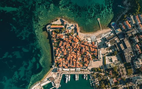 Free Stunning aerial photograph of Budva's historic architecture and vibrant Adriatic Sea. Stock Photo