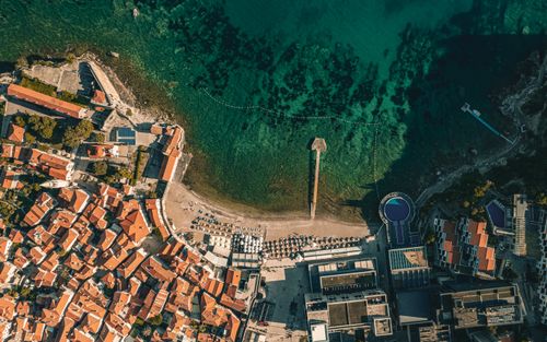 Free Stunning aerial view of Budva, Montenegro, showcasing coastal architecture and clear blue waters. Stock Photo