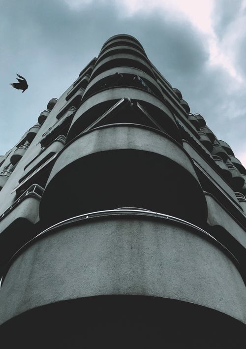 Free Elegant modern building with curved balconies against a cloudy sky in Istanbul. Stock Photo